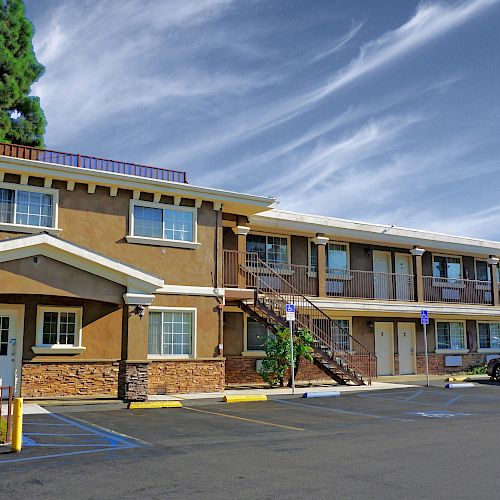 The image shows a two-story motel named 